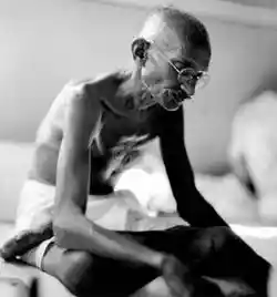 The picture depicts Gandhi's last peaceful protest - the hunger strike to stop communal violence; Image Source: Public Domain
