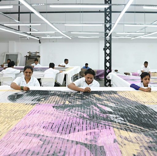 L-Artisans at Chanakya embroidering the tapestry for the Dior Haute Couture Spring Summer 2023
