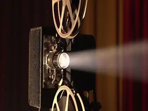 An old movie projector; Image source: wallpaperaccess.com