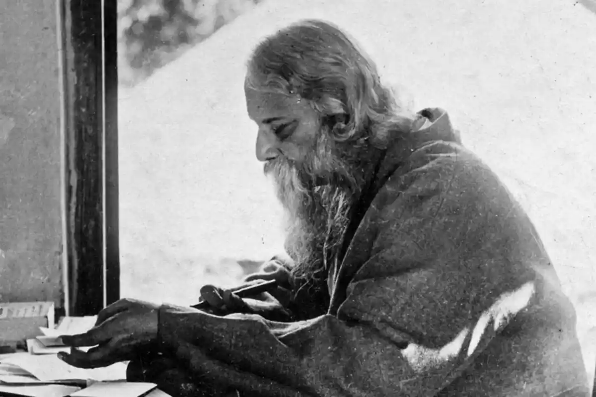 A picture of Tagore engaged in composing something; Image Source- The Wire 
