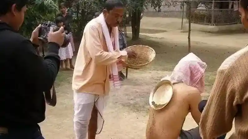 A person using black magic to cure back ache. Image source: The Sentinel Assam 