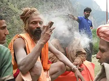 Aghori Baba smoking from chillum (2011). Source: Wikimedia Commons