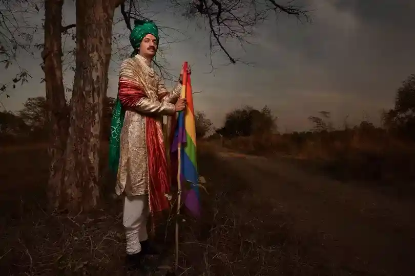 PRINCE MANVENDRA SINGH GOHIL PROUDLY HOLDS A RAINBOW FLAG IN HIS ANCESTRAL HOMELAND OF RAJPIPLA, GUJARAT; Image Source:MARCELLO BONFANTI